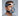 Man wearing a Philips Respironics ComfortGel full face CPAP mask with blue gel cushion and headgear, shown at an angle.